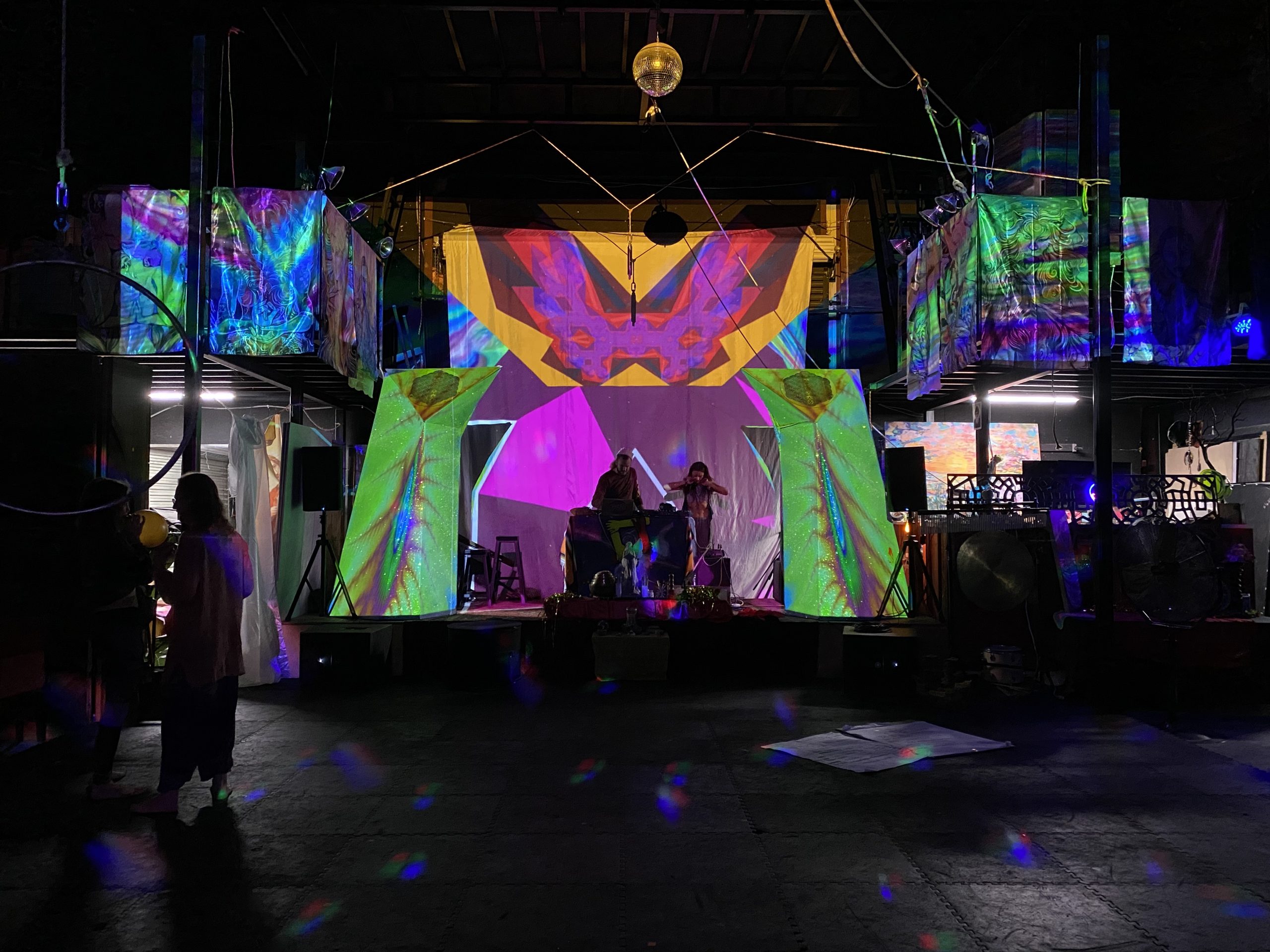 Projection-mapped stage inside Indra's Awarehouse
